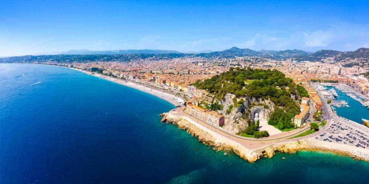 Cyclist riding coastal road in the French Riviera, Côte d’Azur